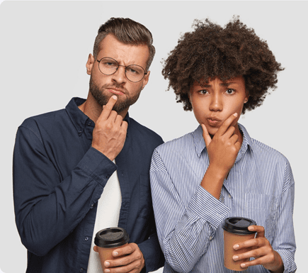 5 Resume Mistakes Gen Z Makes and How to Fix Them 3 Two people, one male with a beard and glasses and one female with curly hair, both posing thoughtfully while holding coffee cups.